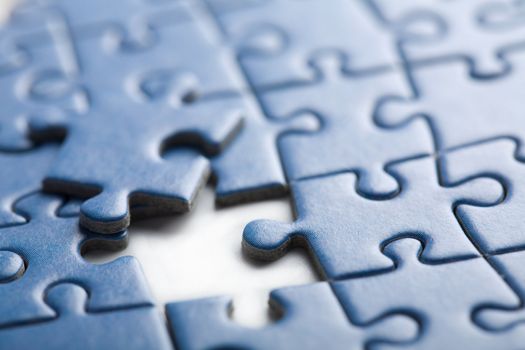 abstract puzzle background with one piece missing 