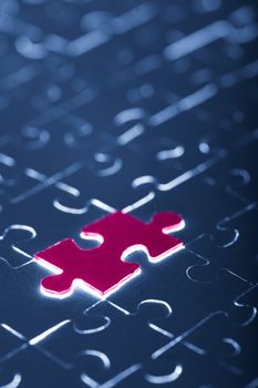 blue puzzle with one red piece