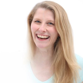 Young girl witha bright big smile and pretty long blonde hair sharing her happiness