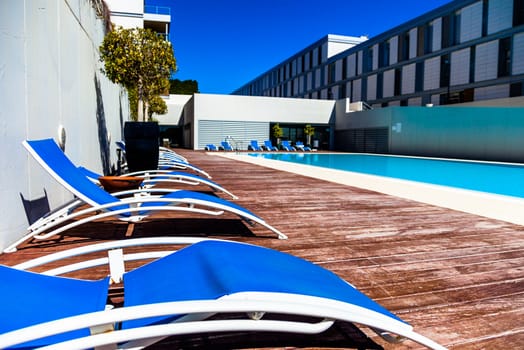 Several deckchairs near the swimming pool