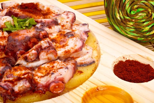 Octopus with paprika, potatoes and olive oil typical of Galicia, Spain