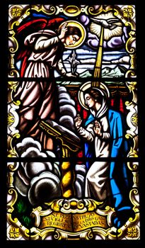 Wonderful ancient stained glass window formed of multiple colors of the Church of Santa  Cruz, Cadiz, Spain