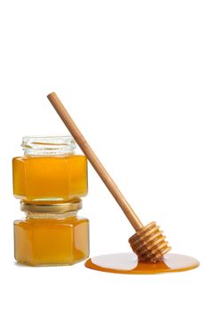 wooden dipper with honey and bottle isolated
