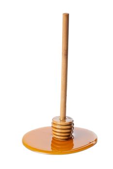wild honey and wooden dipper isolated
