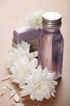 spa and body care - cosmetic bottle and flowers