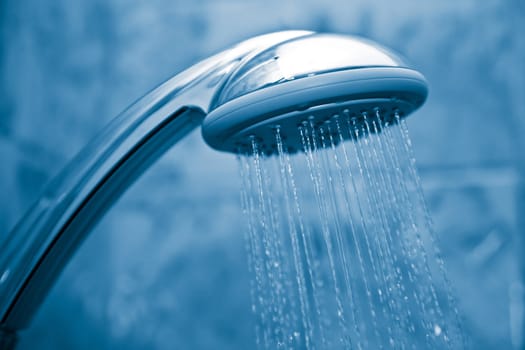 water flowing from metal shower

