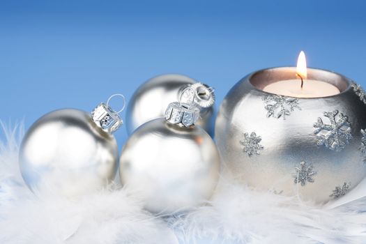 silver christmas balls and candle