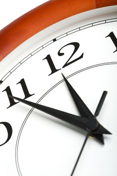 round clock showing time about twelve isolated
