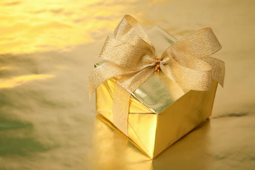 golden gift box with bow