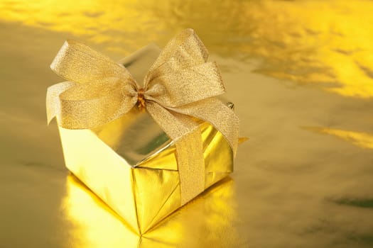 golden gift box with bow
