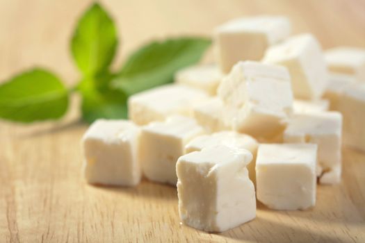 feta cheese on wooden cutting board
