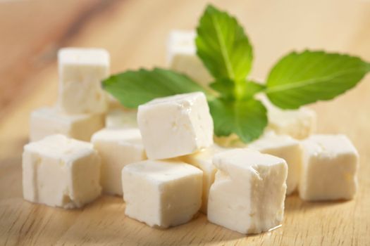 feta cheese on wooden cutting board
