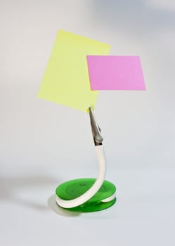 clip stand and post it note, put your message on paper