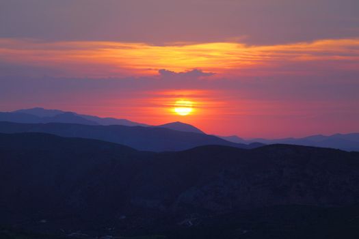 Summer landscape in mountains with the sun