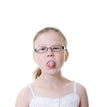 preteen girl sticking her tongue out isolated on white