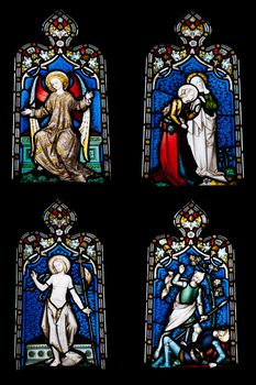 collection of 4 religious stained glass windows in Gloucester Cathedral, England (United Kingdom) (isolated on black background)