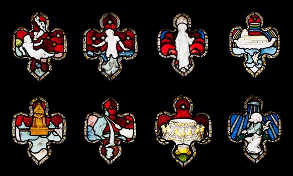 collection of 8 religious stained glass windows in Gloucester Cathedral, England (United Kingdom) (isolated on black background)