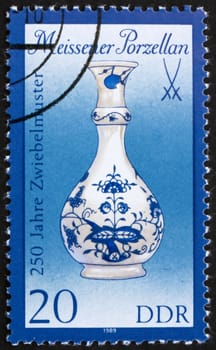 GDR - CIRCA 1989: a stamp printed in GDR shows Vase, 250th Anniversary of Meissen Onion-pattern Porcelain and Sword Emblem, circa 1989