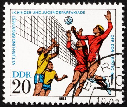 GDR - CIRCA 1983: a stamp printed in GDR shows Volleyball, 9th Children�s and Youths� Spartakiade, circa 1983