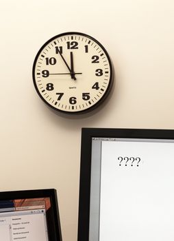 Concept for urgent decision making with clock on paper and question mark on pad