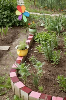 Various old items adorn the small garden