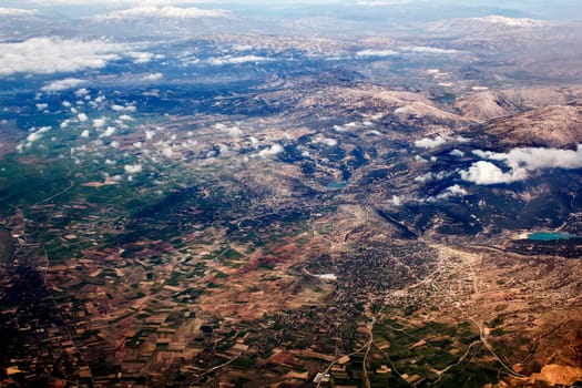 view of the mountains from an airplane above the clouds