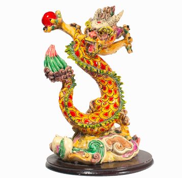 Chinese style Dragon holding red ball  statue isolated on white