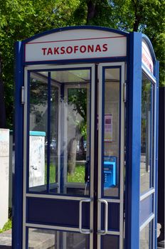 Calling phone cabin in city center Vilnius Lithuania. Pay telephone service.