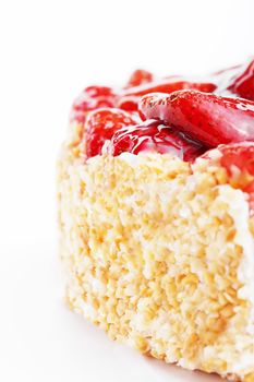 closeup from the back of a strawberry cake on white background