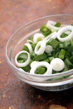 spring onion slices in a glass bowl