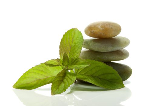 green mint and rocks as a tower in balance