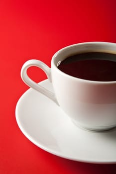 cup of coffee over red background
