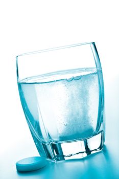 pills and glass of water