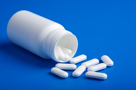 white pills over blue
