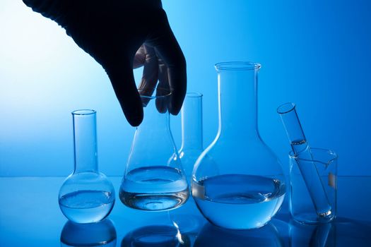hand holding chemical flask