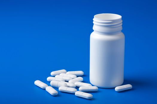 white pills over blue
