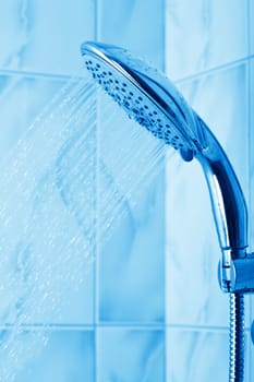 water flowing from metal shower
