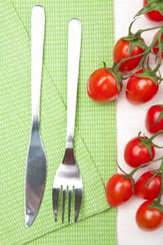 fork knife and tomatoes