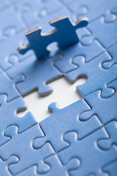 abstract puzzle background with one piece missing
