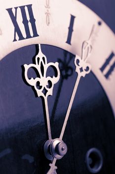 antique clock showing time about twelve 