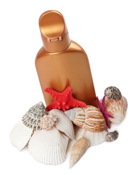suntan lotion and sea shells isolated 
