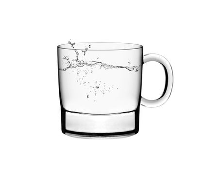 A glass of water and water splahes on white background