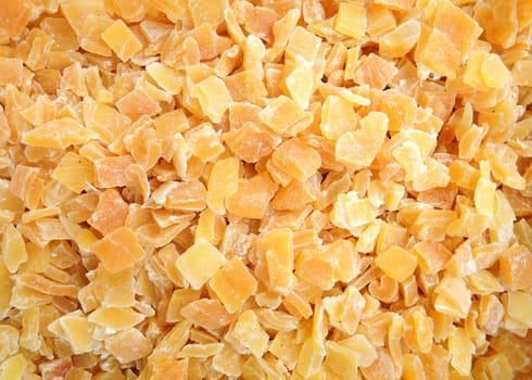 background of colorful pieces of dried mango fruit

