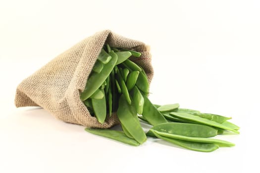 green sugar peas in a jute sack