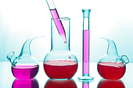 laboratory glassware with colorful chemicals 