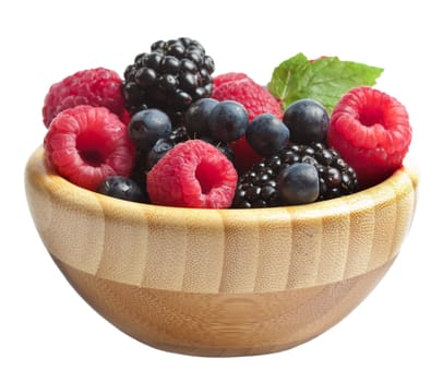 berries in wood bowl isolated