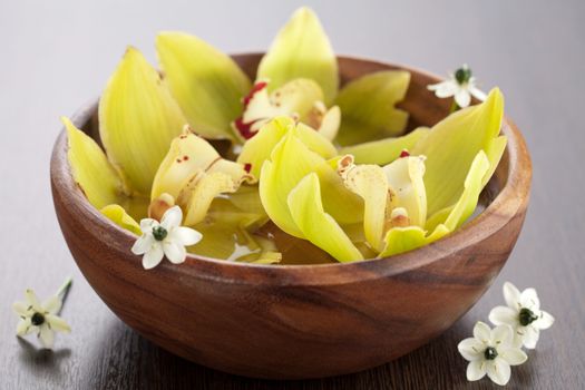 yellow orchids in bowl 