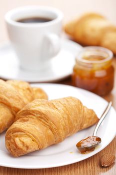 croissant with jam for breakfast 