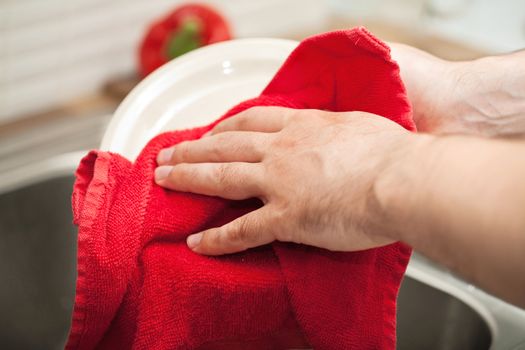 man drying the dishes