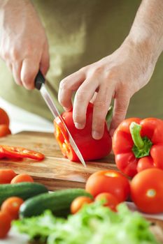 man cutting vegetables